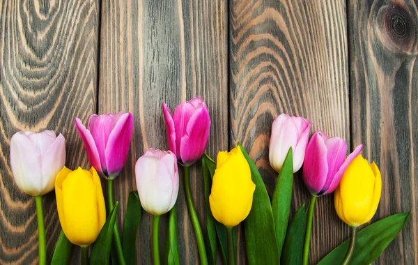 Border with pink and yellow tulips — Stock Photo, Image