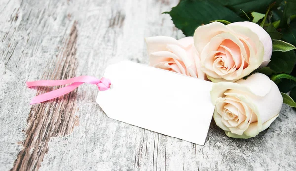 Roses with a card — Stock Photo, Image
