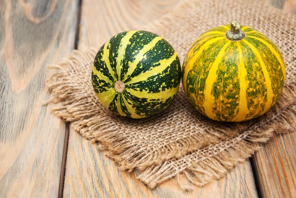 Autumn pumpkins on burlup — Stock Photo, Image