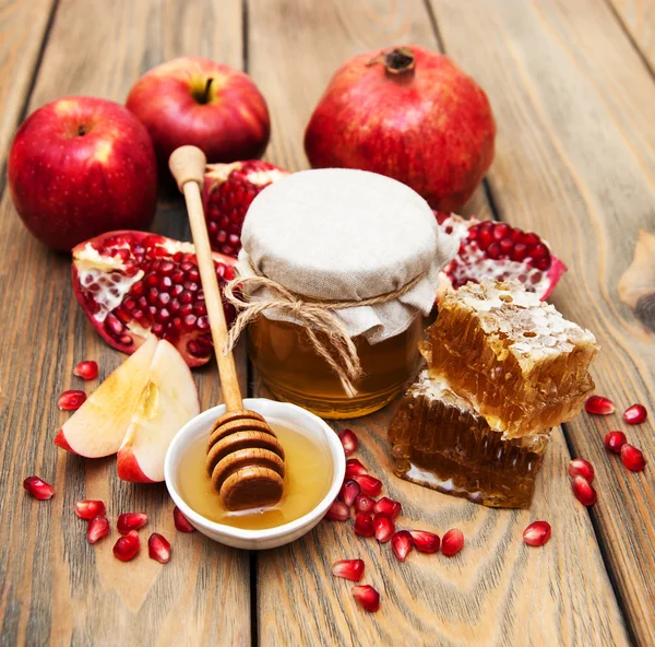 Honey with pomegranate and apples — Stock Photo, Image