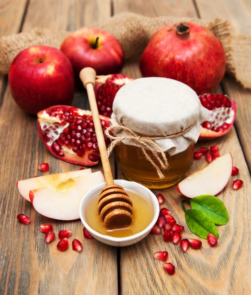 Honey with pomegranate and apples — Stock Photo, Image