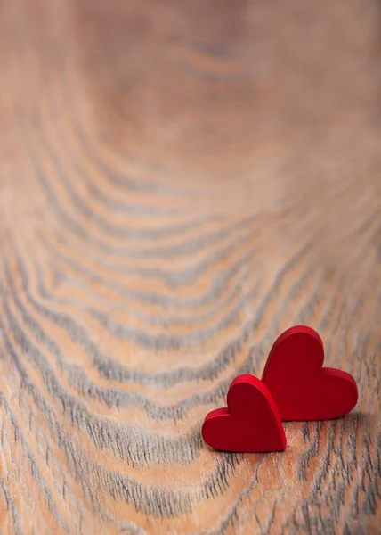 Srdce na dřevěné pozadí — Stock fotografie