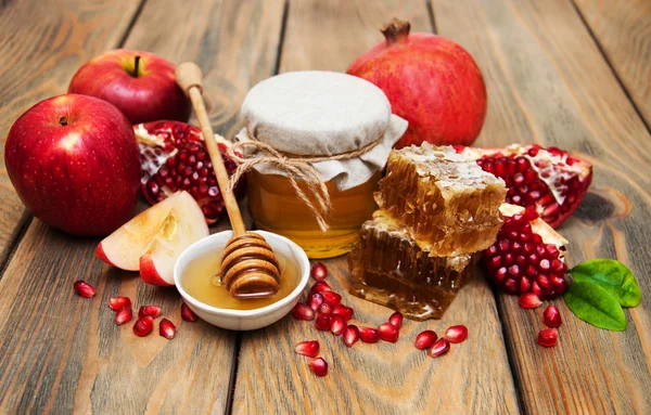Honey with pomegranate and apples — Stock Photo, Image