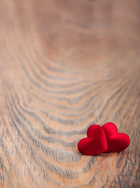 Hearts on a wooden background — Stock Photo, Image