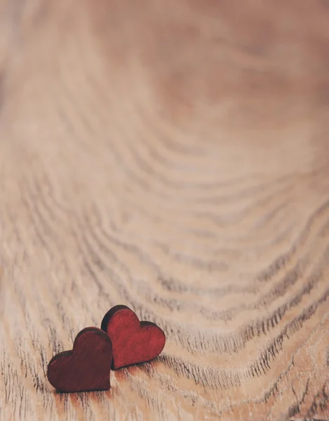 Hearts on a wooden background - vintage toning — Stock Photo, Image