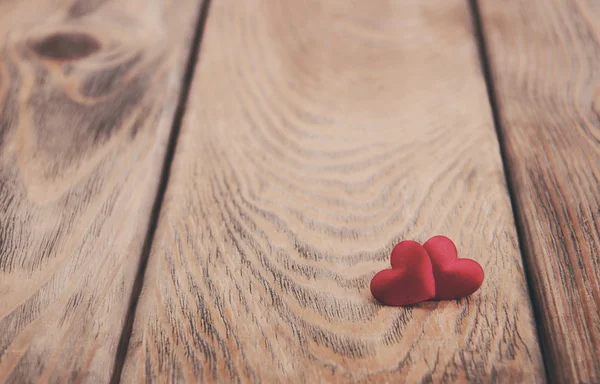 Hearts on a wooden background - vintage toning — Stock Photo, Image