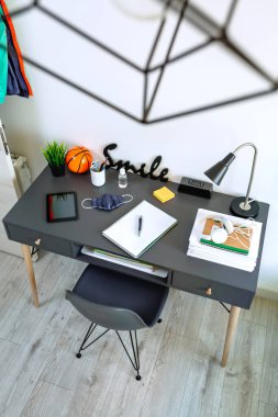 Youth bedroom interior with desk clipart