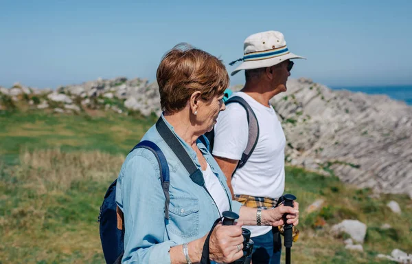Senior couple practicing trekking outdoors — Stock Photo, Image