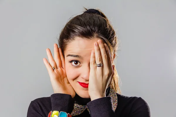 Real girl with red lips using her hand to cover one eye — Stock Photo, Image