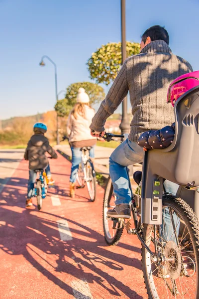 Family with children riding bicycles in the nature — Stock Photo, Image