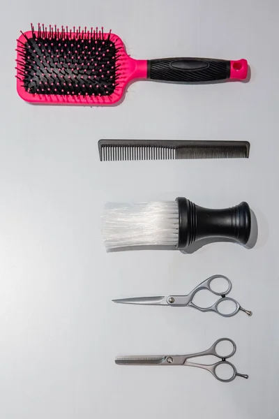 Hairdressing equipment over a white wooden background — Stock Photo, Image