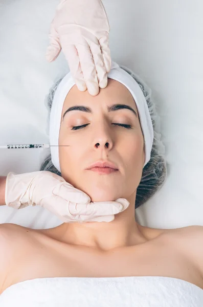 Closeup of woman getting cosmetic injection in the face — Stock Photo, Image