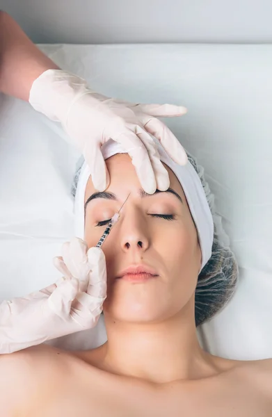 Closeup of woman getting cosmetic injection in the face — Stock Photo, Image