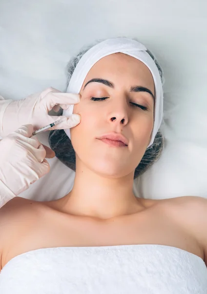 Closeup of woman getting cosmetic injection in the face — Stock Photo, Image