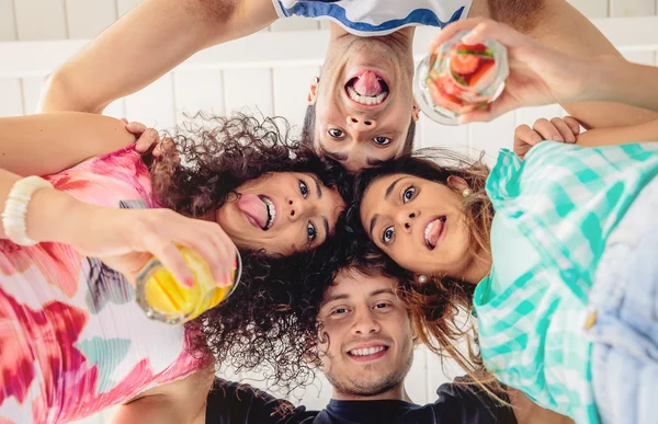 Young people with their heads together having fun — Stock Photo, Image
