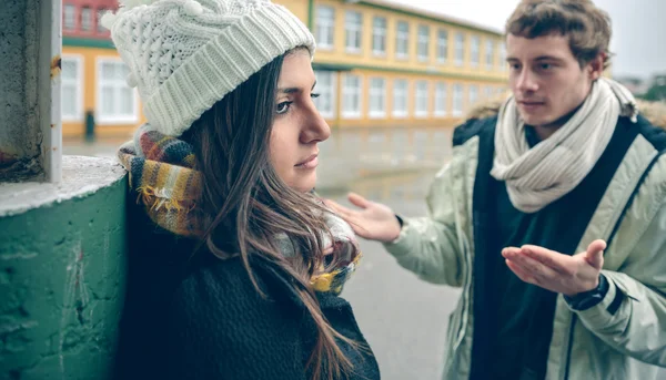 Displeased woman listening arguments of man in quarrel — Stock Photo, Image