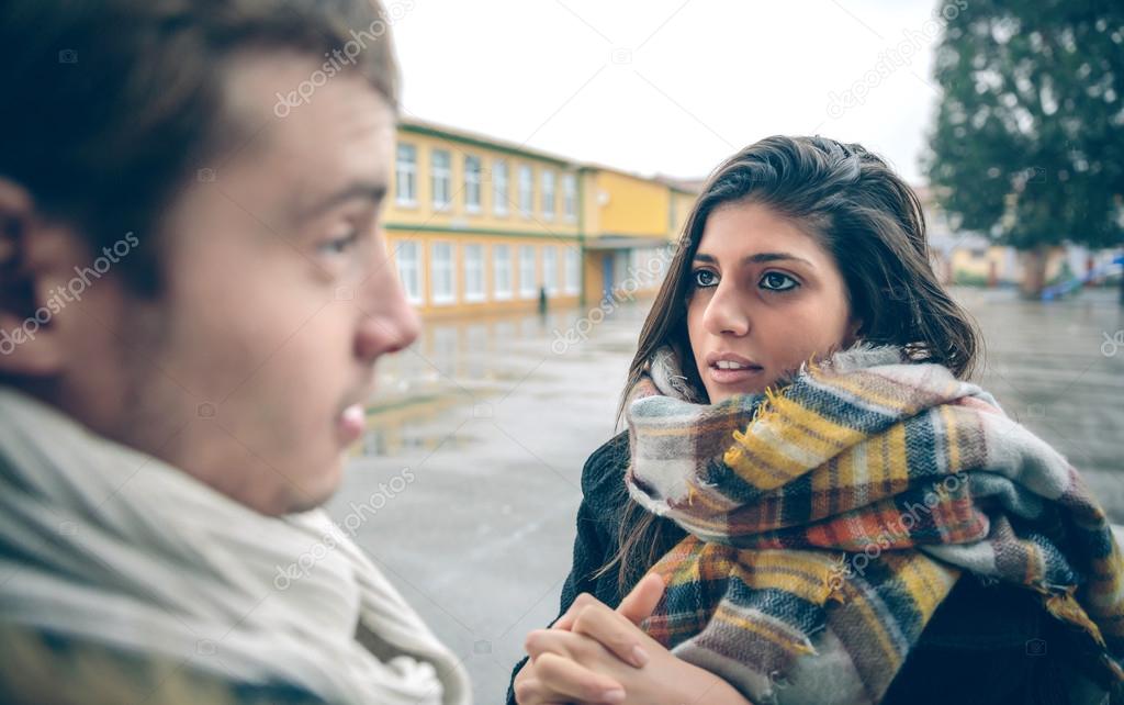 Woman asking apologize to offended man after quarrel