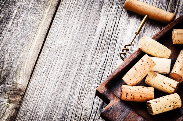 Bunch of wine corks and corkscrew — Stock Photo, Image