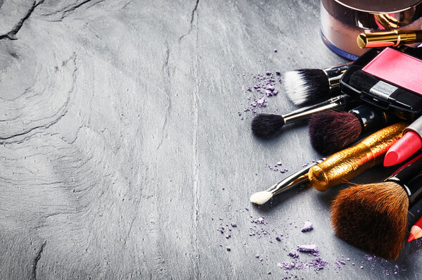 Makeup products on dark background