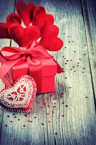 Valentine's setting with gift box and hearts — Stock Photo, Image