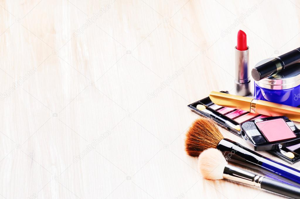 Various makeup products on light background