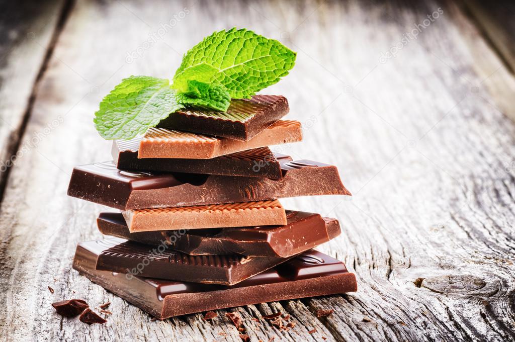Dark and milk chocolate pieces with mint leaf