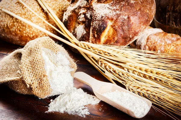 Fresh bread and baking ingredients — Stock Photo, Image