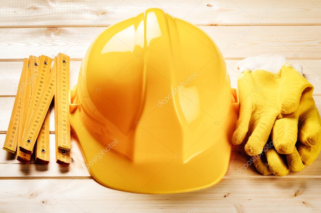 Hard hat, ruler and protection gloves