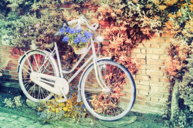 Old bicycle with flowers clipart