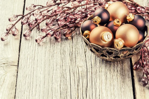 Baubles and garland in brown tone — Stock Photo, Image