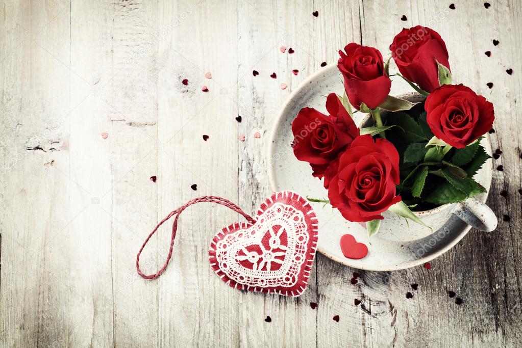 St Valentine's setting with bouquet of red roses