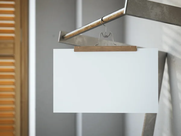 Вешалка для брюк с белым листом бумаги. 3d-рендеринг — стоковое фото