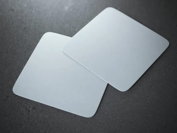 Two white square beer coasters — Stock Photo, Image