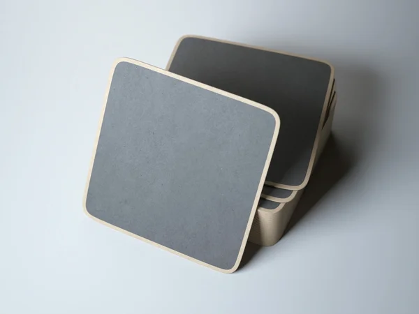Stack of black square beer coasters — Stock Photo, Image