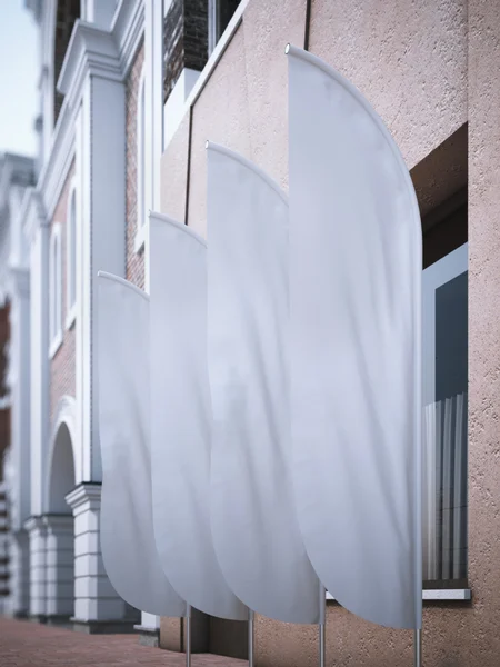 Sokakta dört beyaz dikey Rüzgar afiş. 3D render — Stok fotoğraf