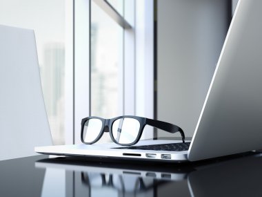 Ofis büro dizüstü bilgisayar ve gözlük. 3D render