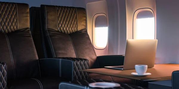 Business Class im Flugzeuginnenraum mit gemütlichen Ledersesseln. Moderner Laptop Komfortabler Flug. 3D-Darstellung — Stockfoto
