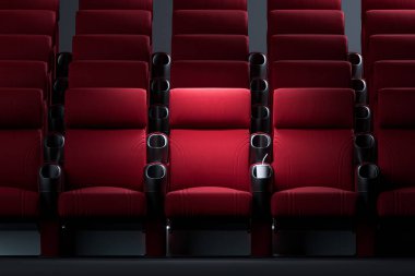Rahat dirsekli sinemanın rahat koltukları. Ortadaki 3D yapılandırmada aydınlatılmış koltuk..