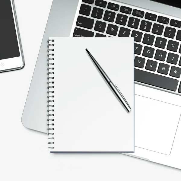 Blank notepad and laptop — Stock Photo, Image