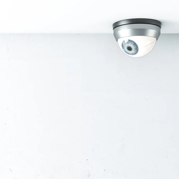 Caméra de sécurité avec oeil bleu sur le plafond — Photo
