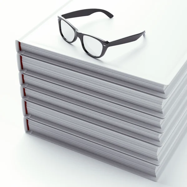 Stack of books with black glasses — Stock Photo, Image