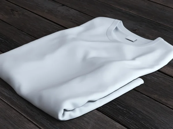 Белая сложенная футболка — стоковое фото