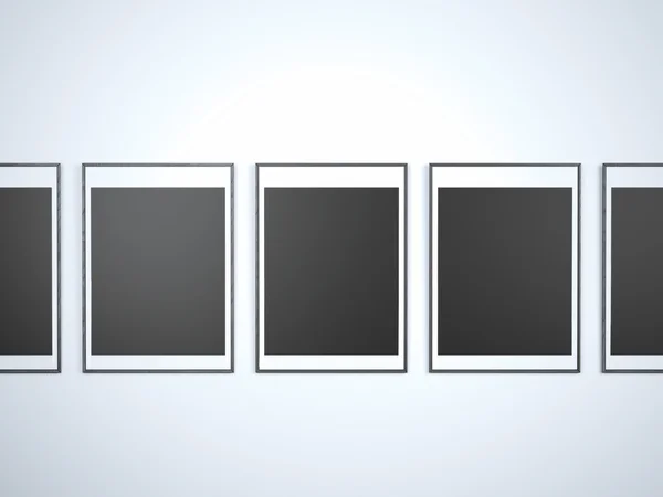 White wall with black blank frames — Stock Photo, Image