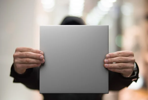 Man with a white blank poster — Stock Photo, Image