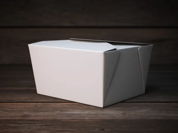 Prázdné bílé balíček na dřevěnou podlahu — Stock fotografie