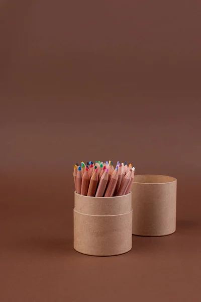 Eco colored pencils made from recycled material. A fence made of wooden pencils. Top view. Free space for text. — Stock Photo, Image