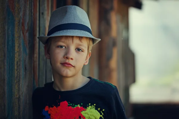 Young attractive boy wearing a hat, looking at the camera. — Stock Photo, Image