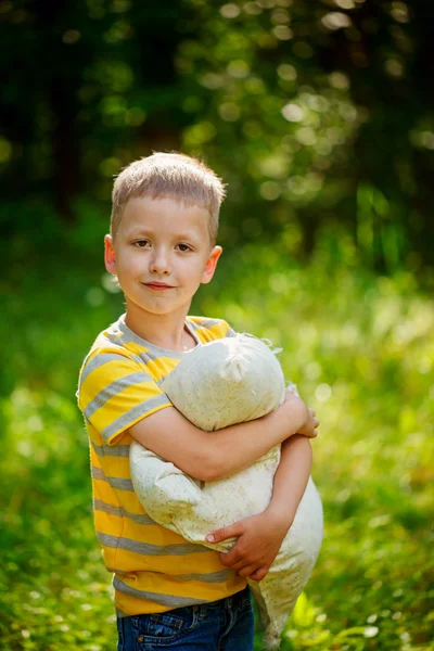 Portrait Little adorable baby boy with pillow in the summer — Stock Photo, Image