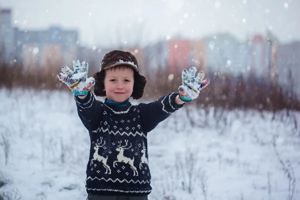 Winter portrait of little kid boy wearing a knitted sweater with — Stock Photo, Image