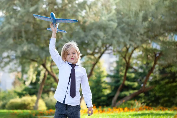 Handsome Child Boy Toothless Smile White Shirt Plays Toy Airplane — Stock fotografie